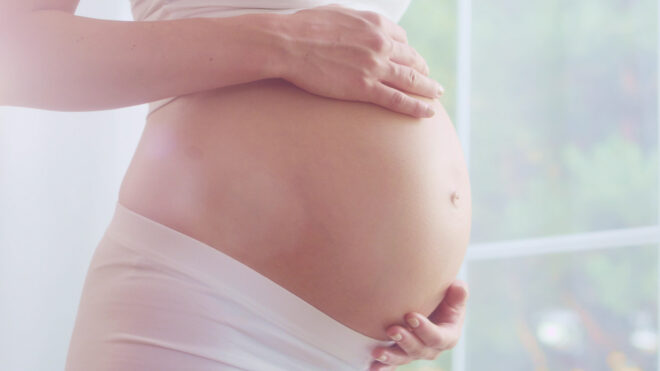 Woman Holding Pregnant Belly