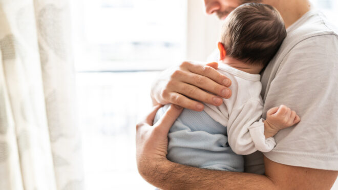 man holding a baby