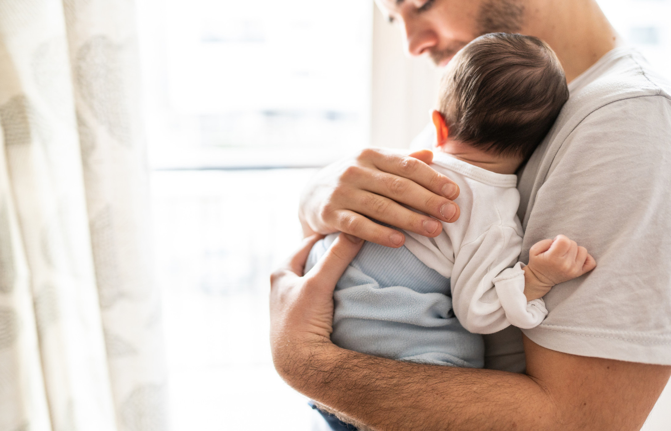 man holding a baby