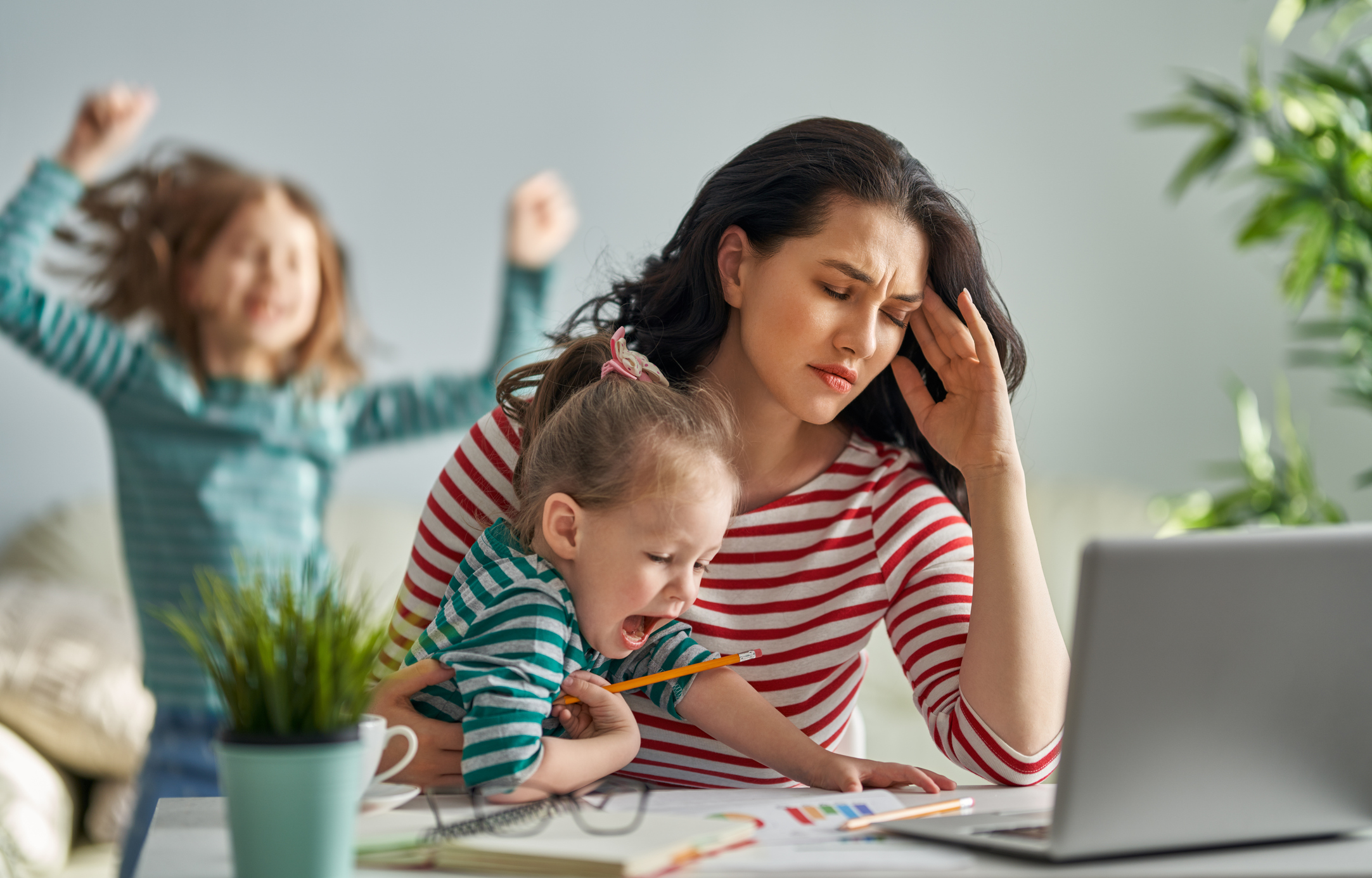 mother with children working on computer