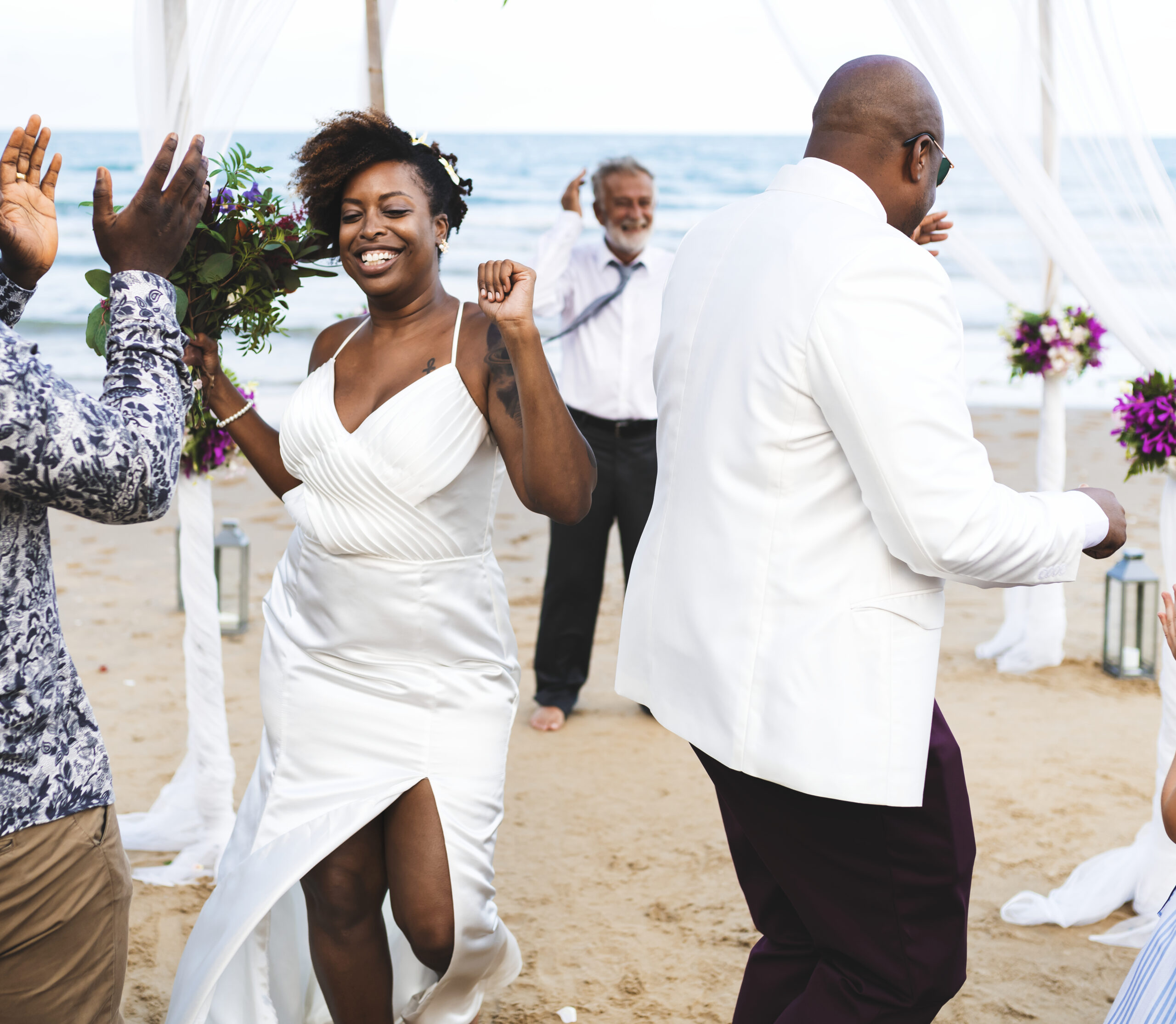 African American couple getting married at the beach