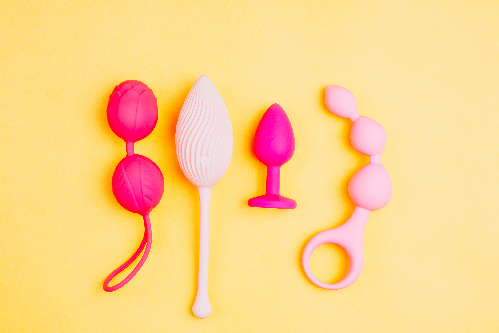 Different sex toys set on a light background.