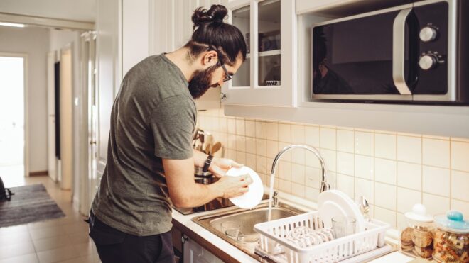 A man washing dishes
