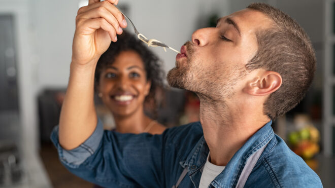 man slurping spaghetti