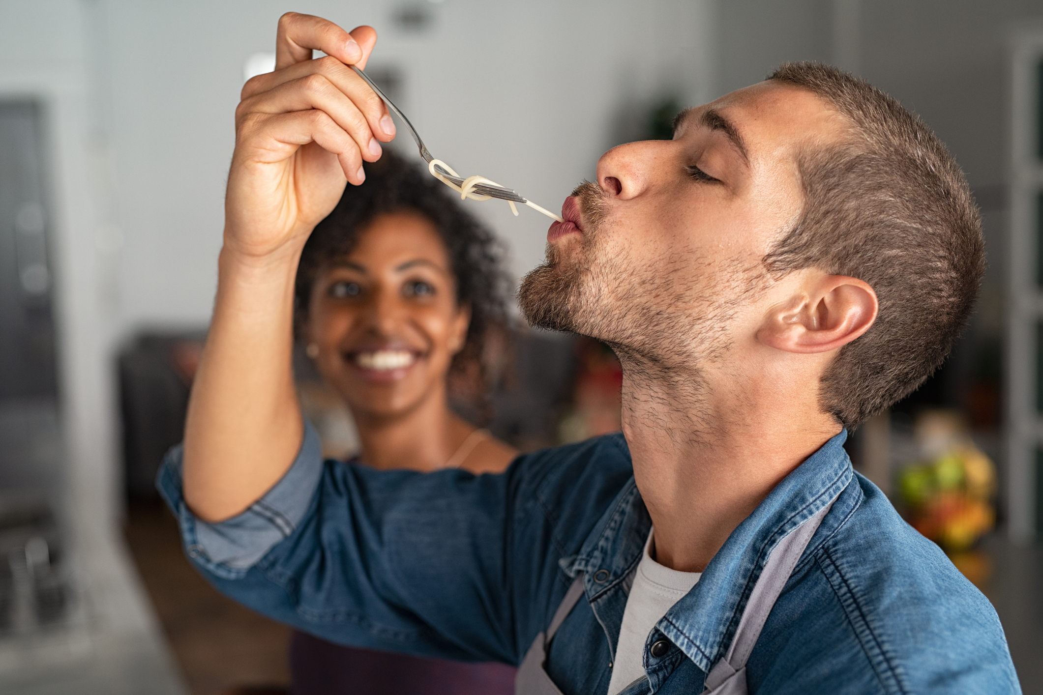 man slurping spaghetti