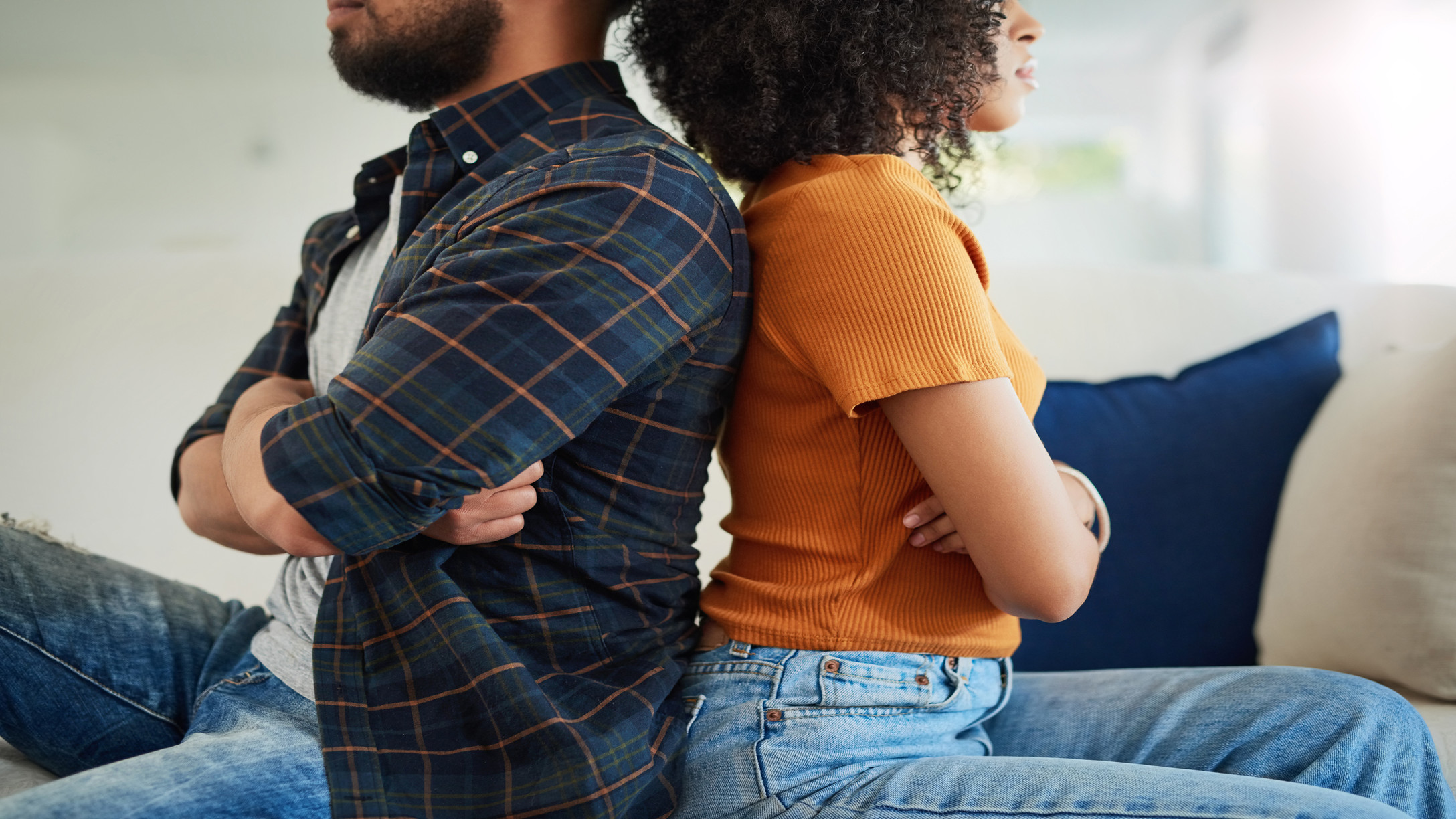 a couple with their backs to each other