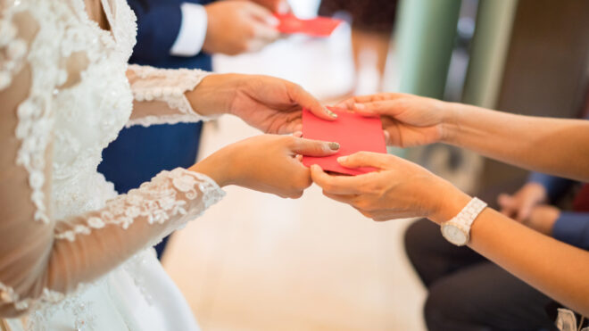 Bride receiving envelope