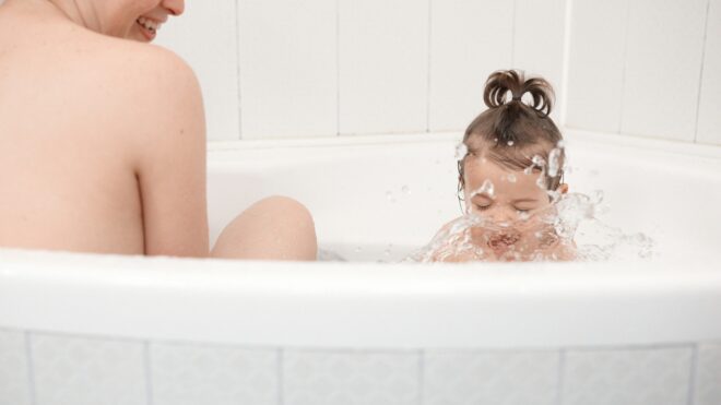 mom and toddler in bath