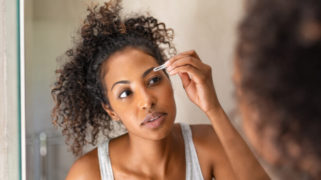 woman grooming eyebrow