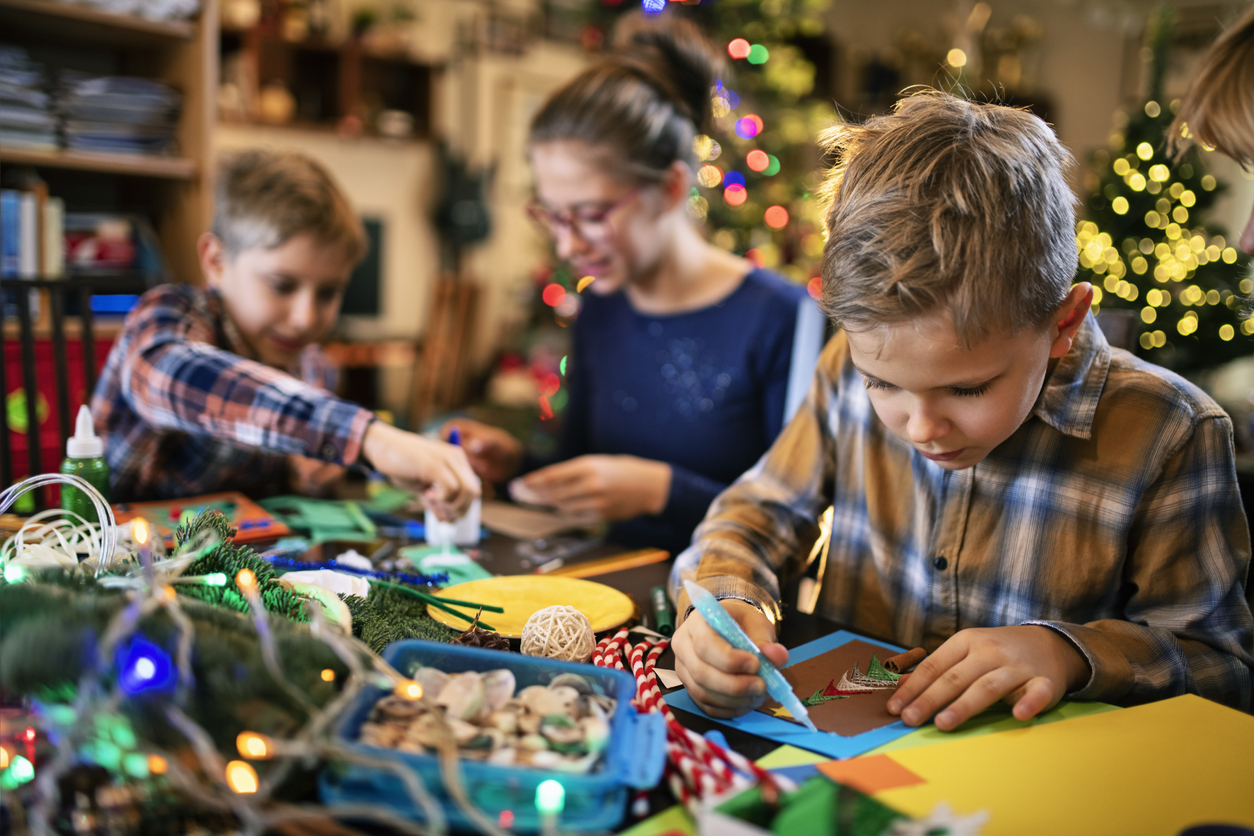 Family crafting Christmas cards