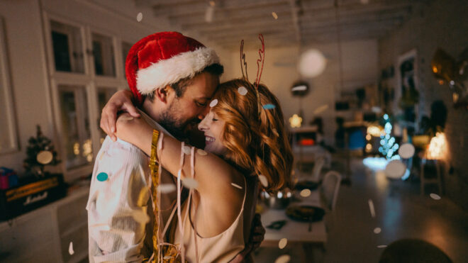 man and woman embracing at holidays