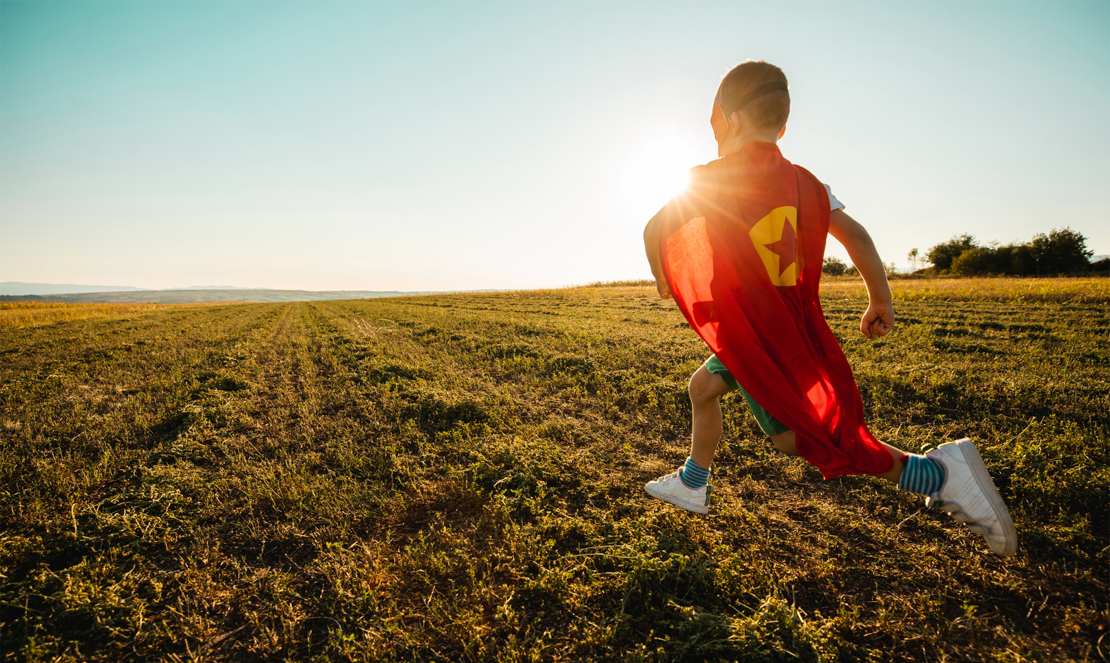 Imagination child running in superhero outfit