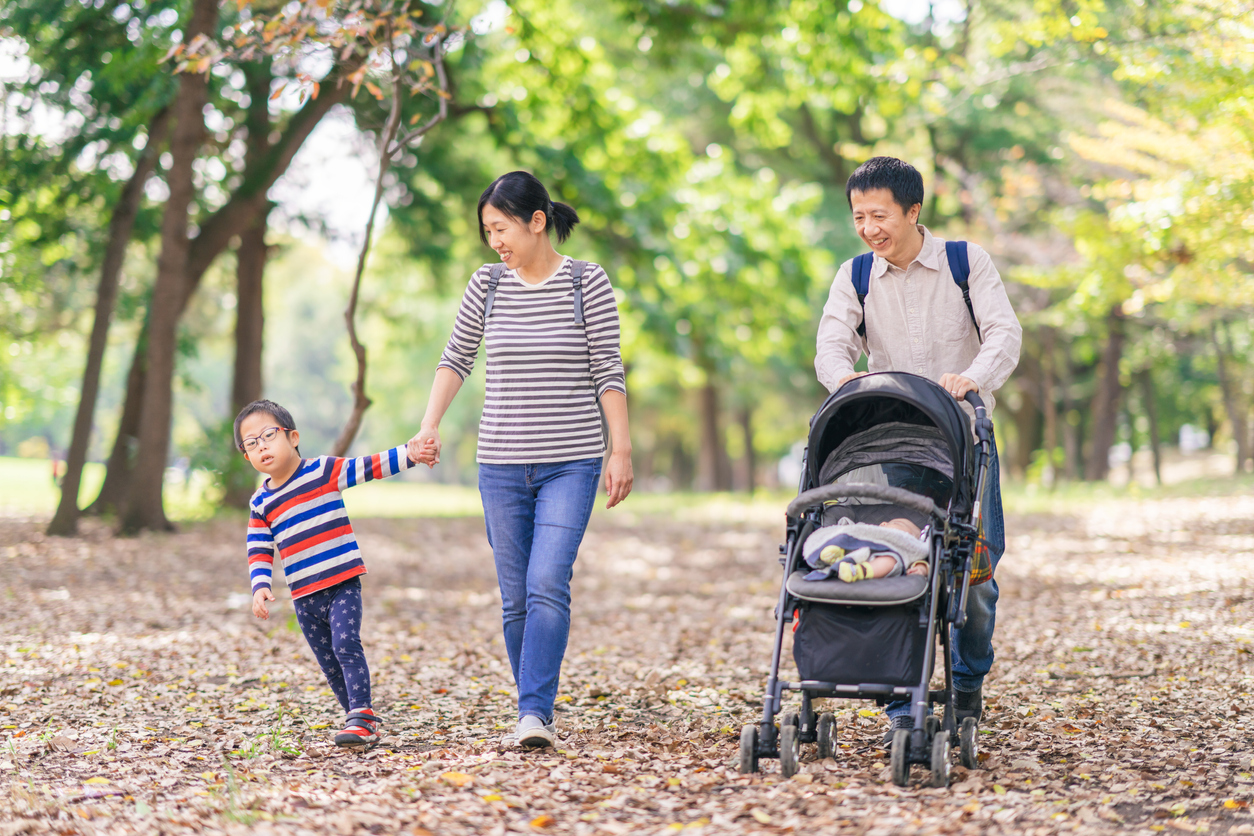Family having walk in public park