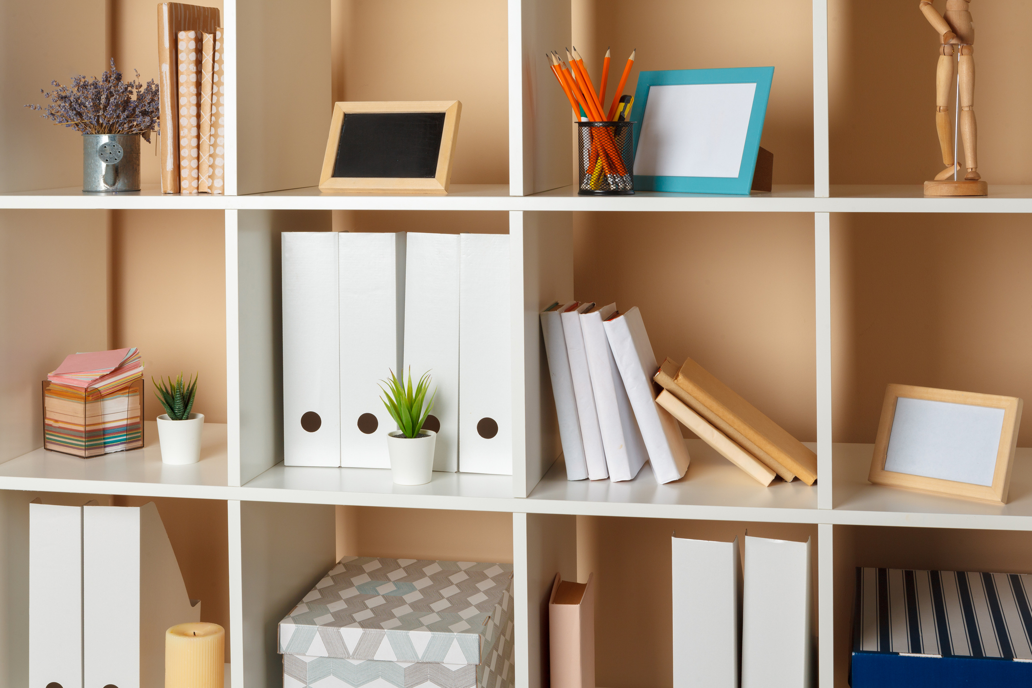 Home office working space. white shelf with accessories Home office working space. white shelf with accessories