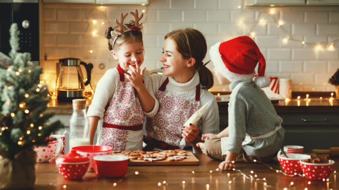 mother and children baking together for the holidays