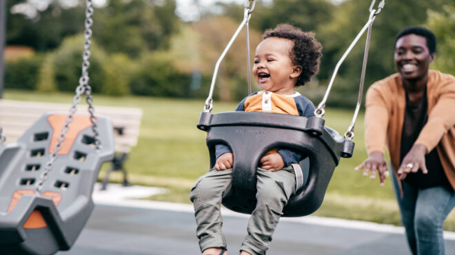 toddler in swing