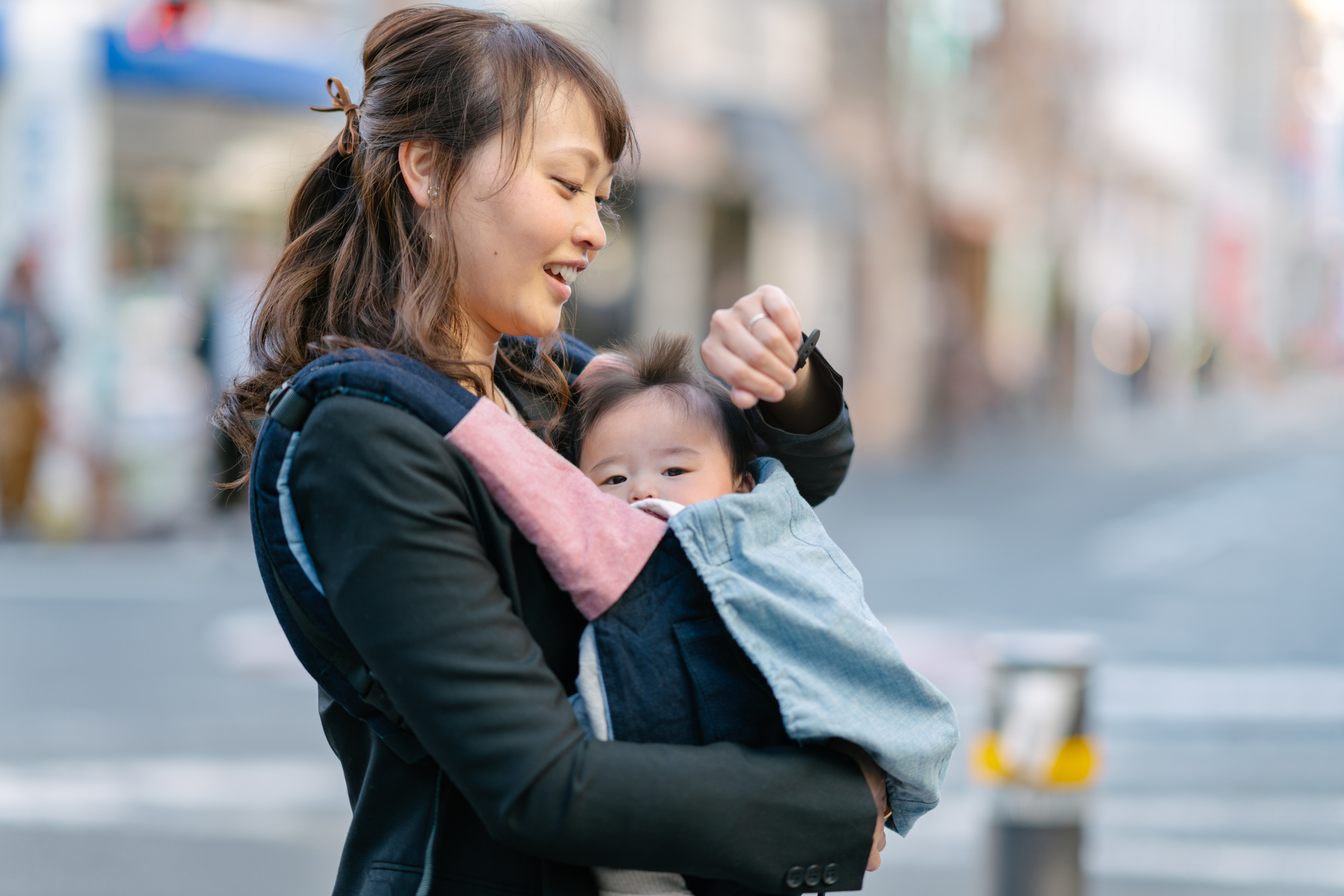 Mother commuting with her baby girl