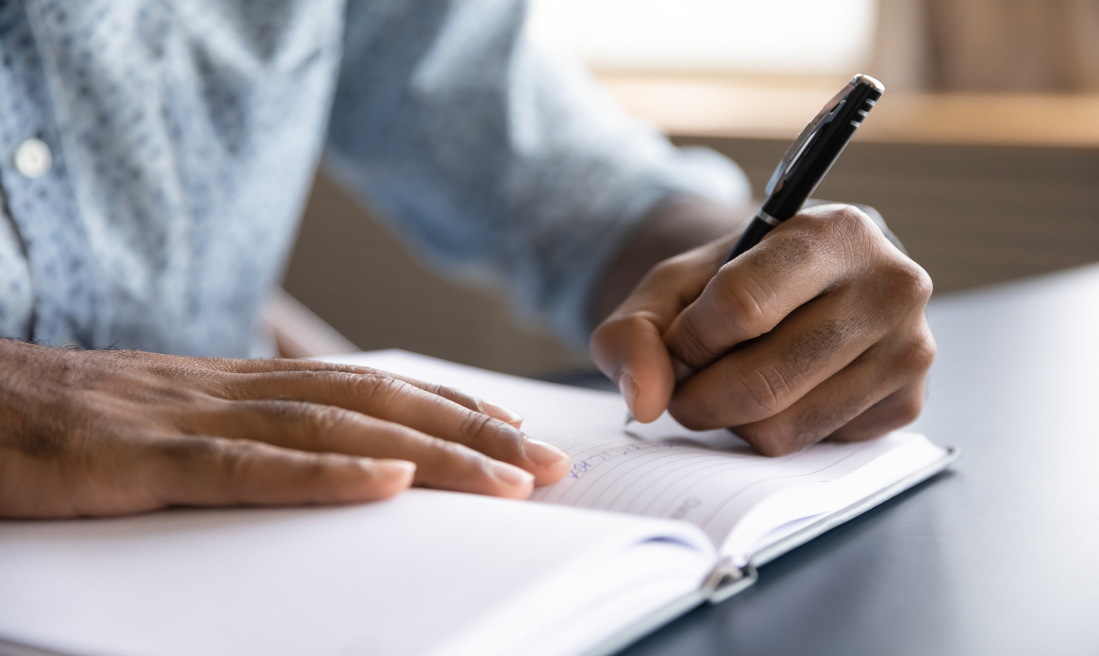 man writing a letter