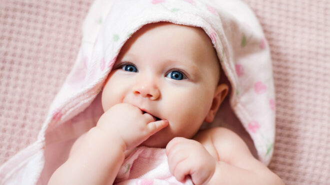 baby girl wrapped in blanket