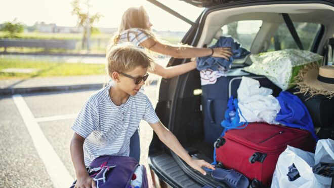 Mom and child packing a car