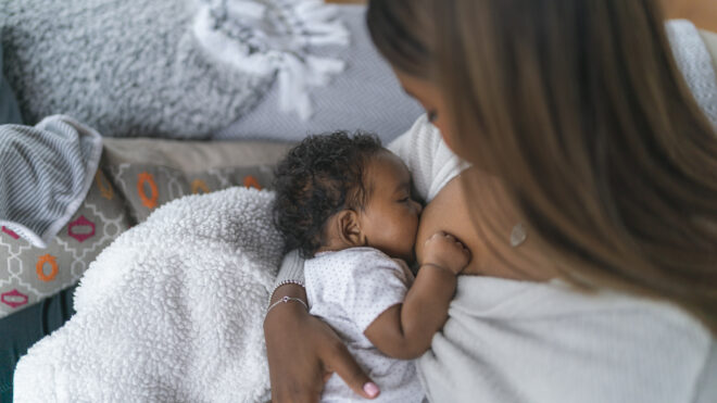 woman nursing baby