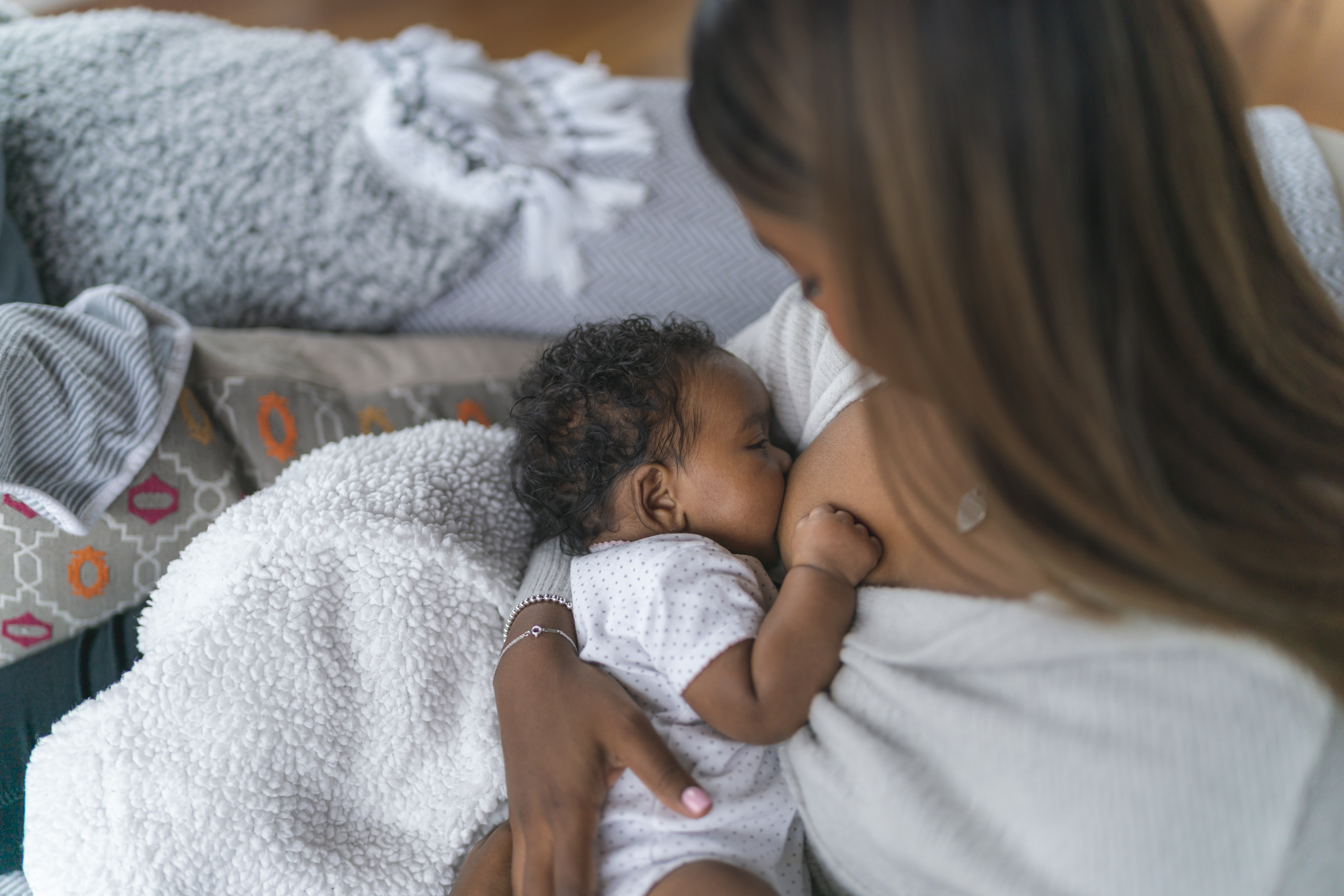 woman nursing baby