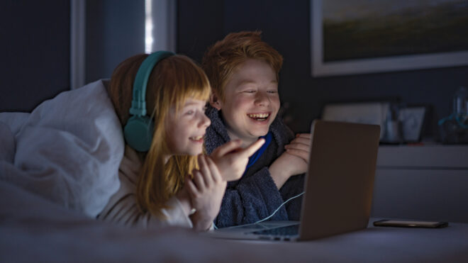 kids watching tv together