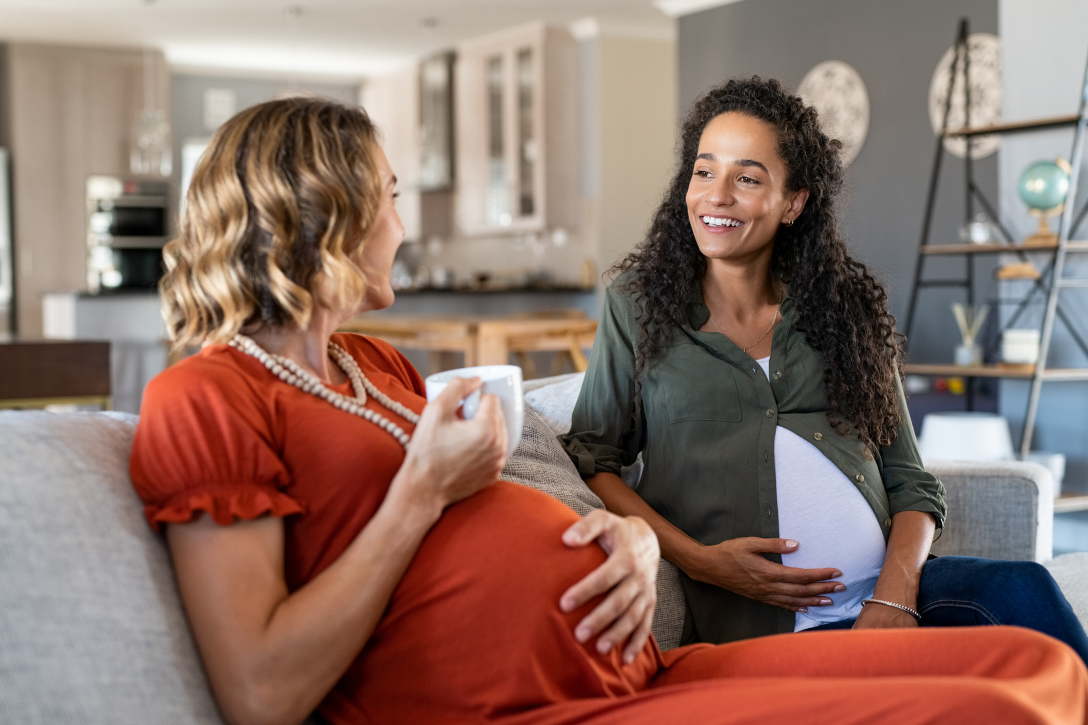 two pregnant women talking