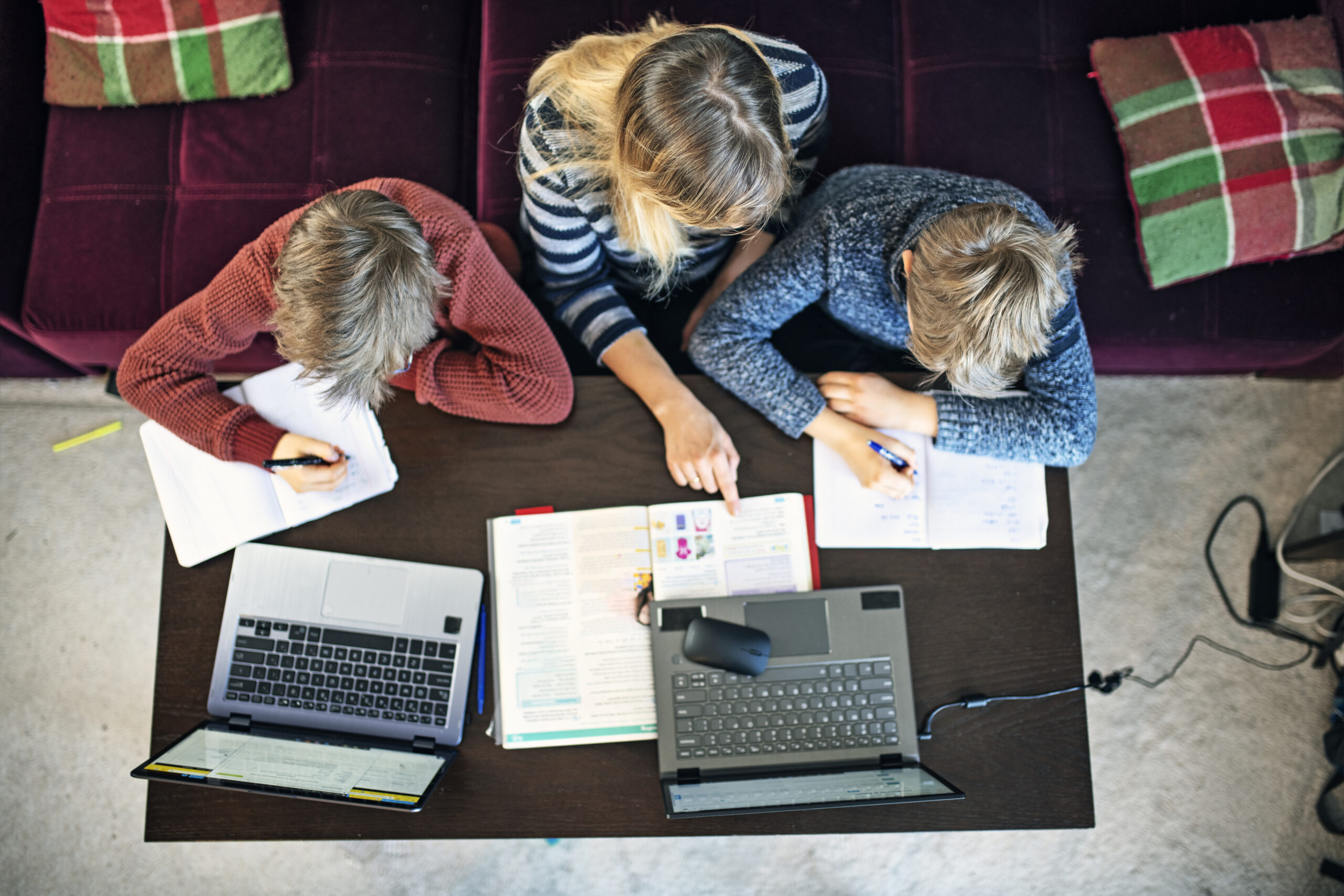 Mother homeschooling her children