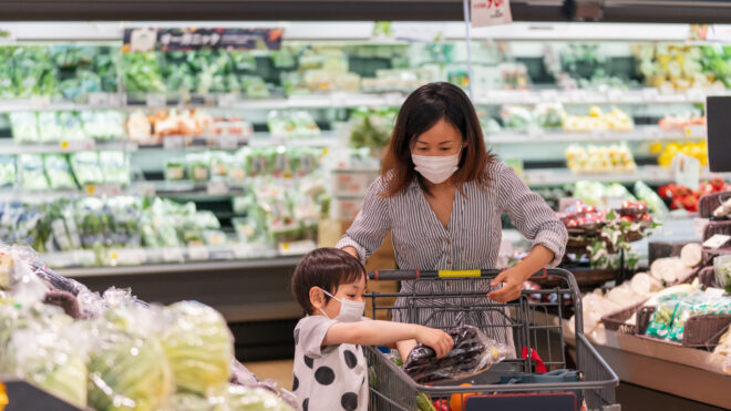 mom and child wear masks in store