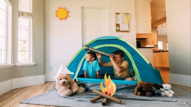 kids playing with tent in living room