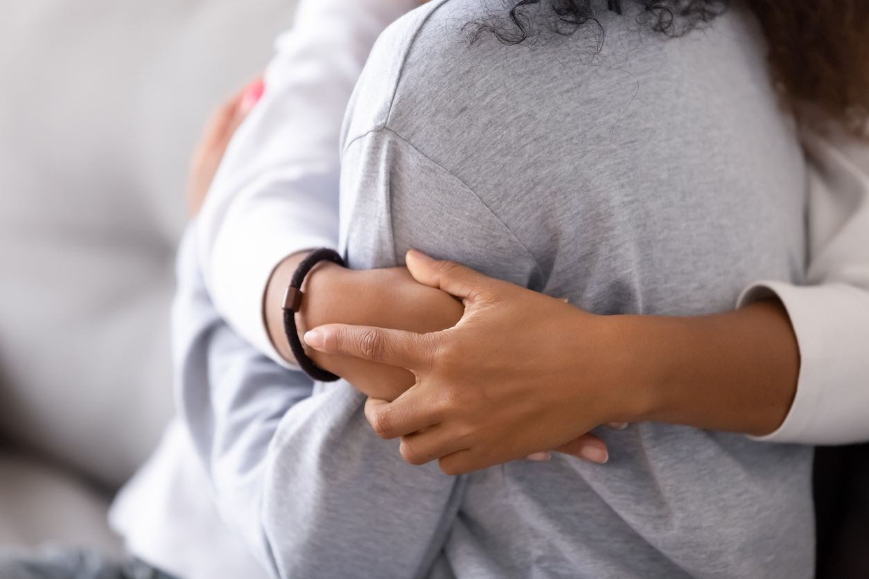 Loving african foster care parent single mother embrace teen daughter