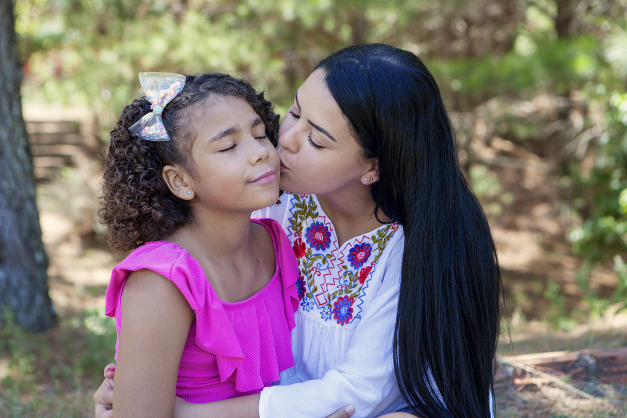 Caucasian mother and black daughter