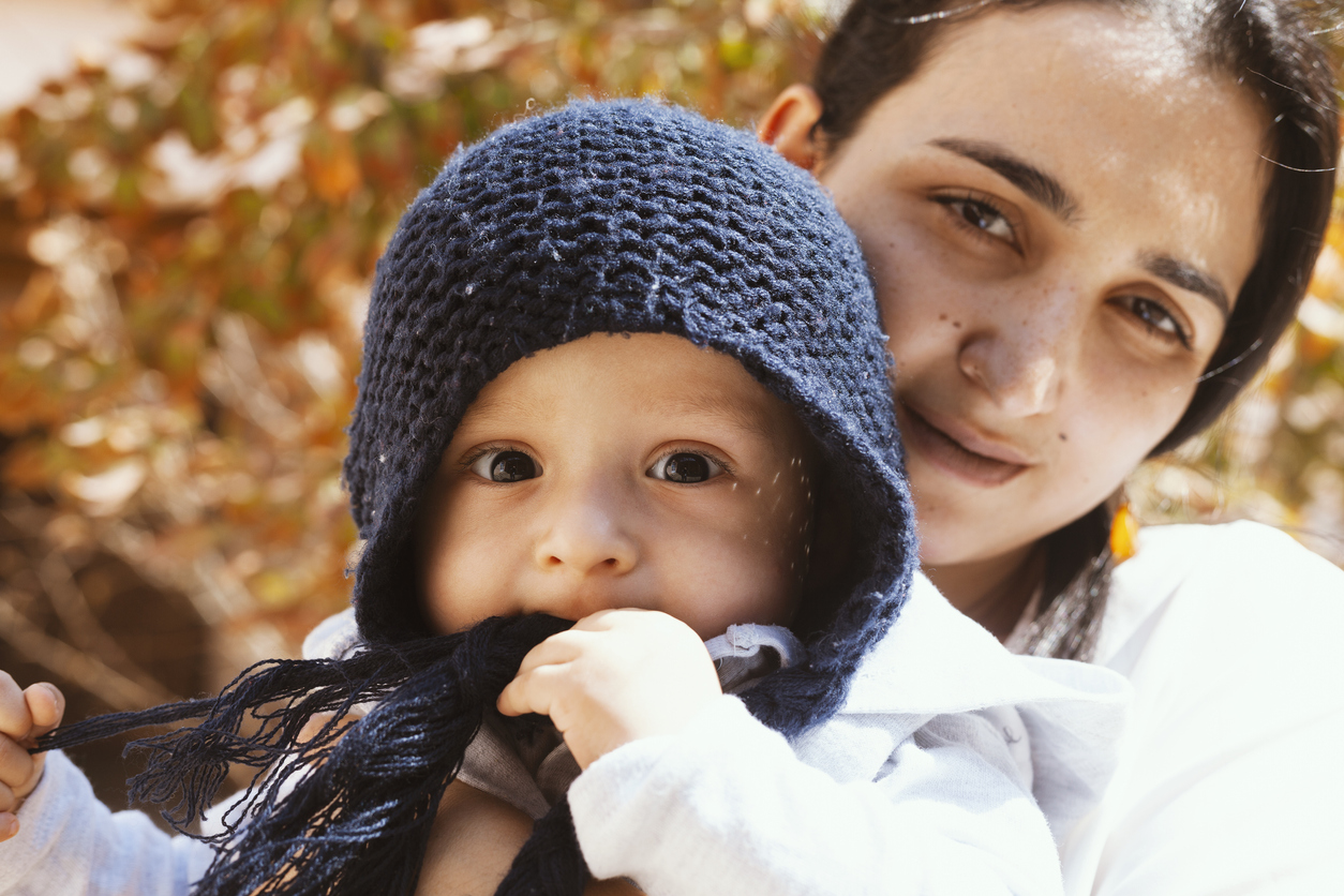 Mother holding cute sweet son