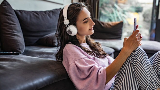 woman listening to a podcast