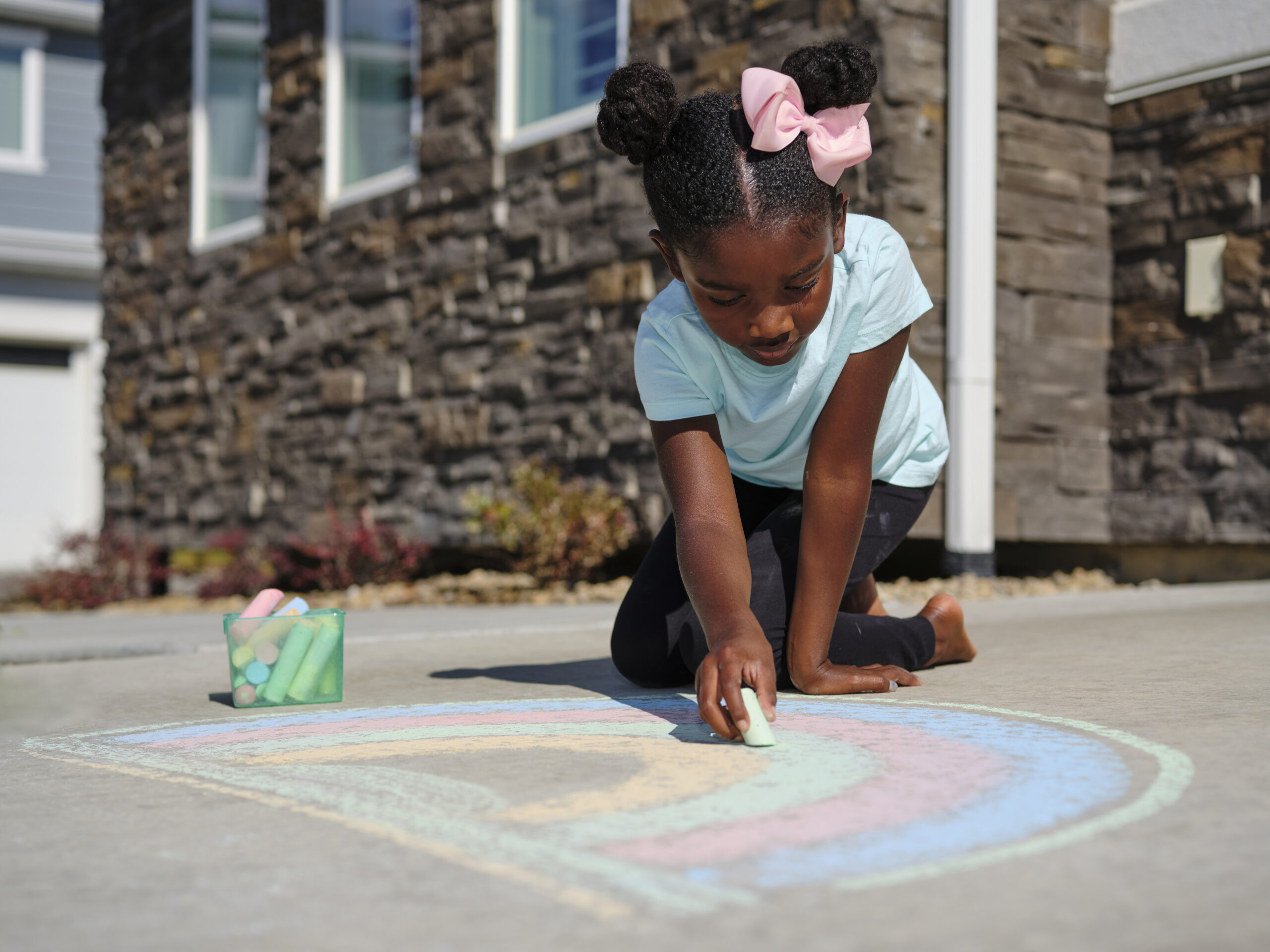 Little Girl Drawing with Sidewalk Chalk