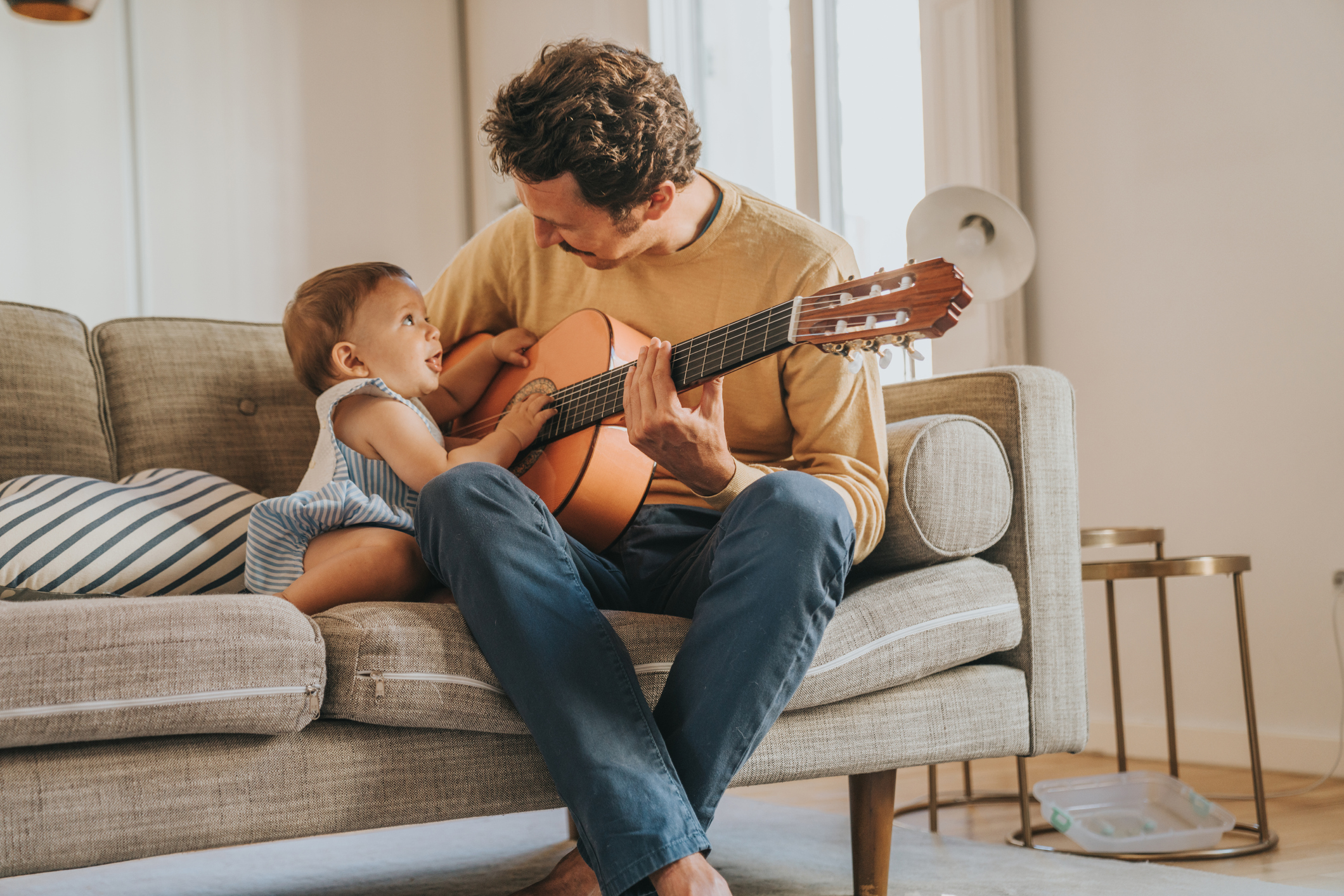 Father Playing Guitar for Baby