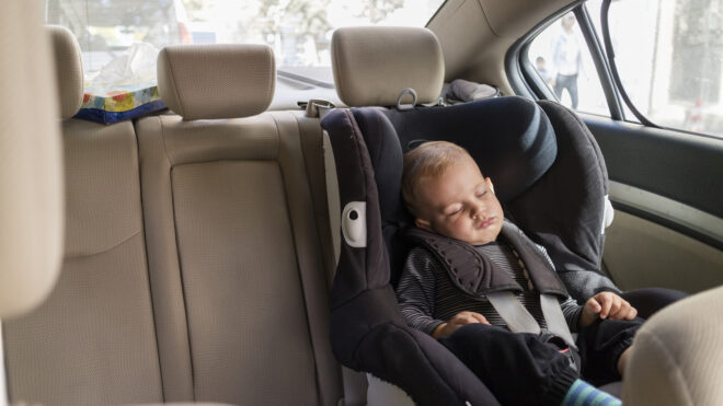 child sleeping in car