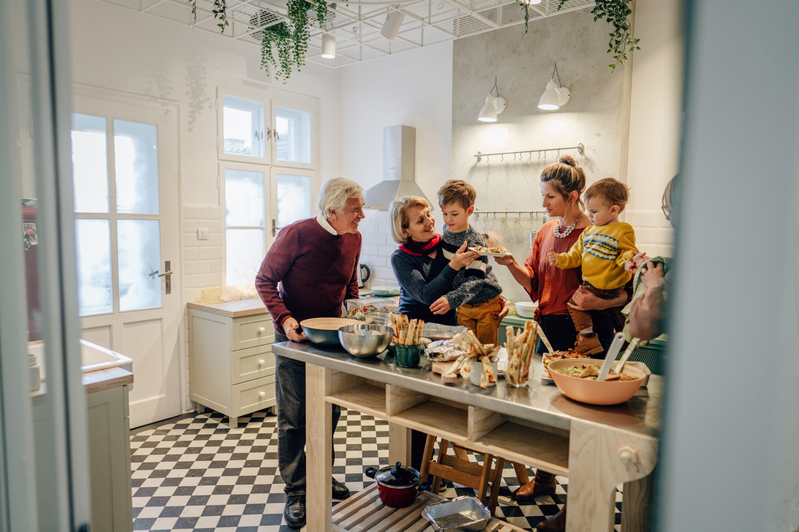 Family preparing Thanksgiving dinner in the kitchen