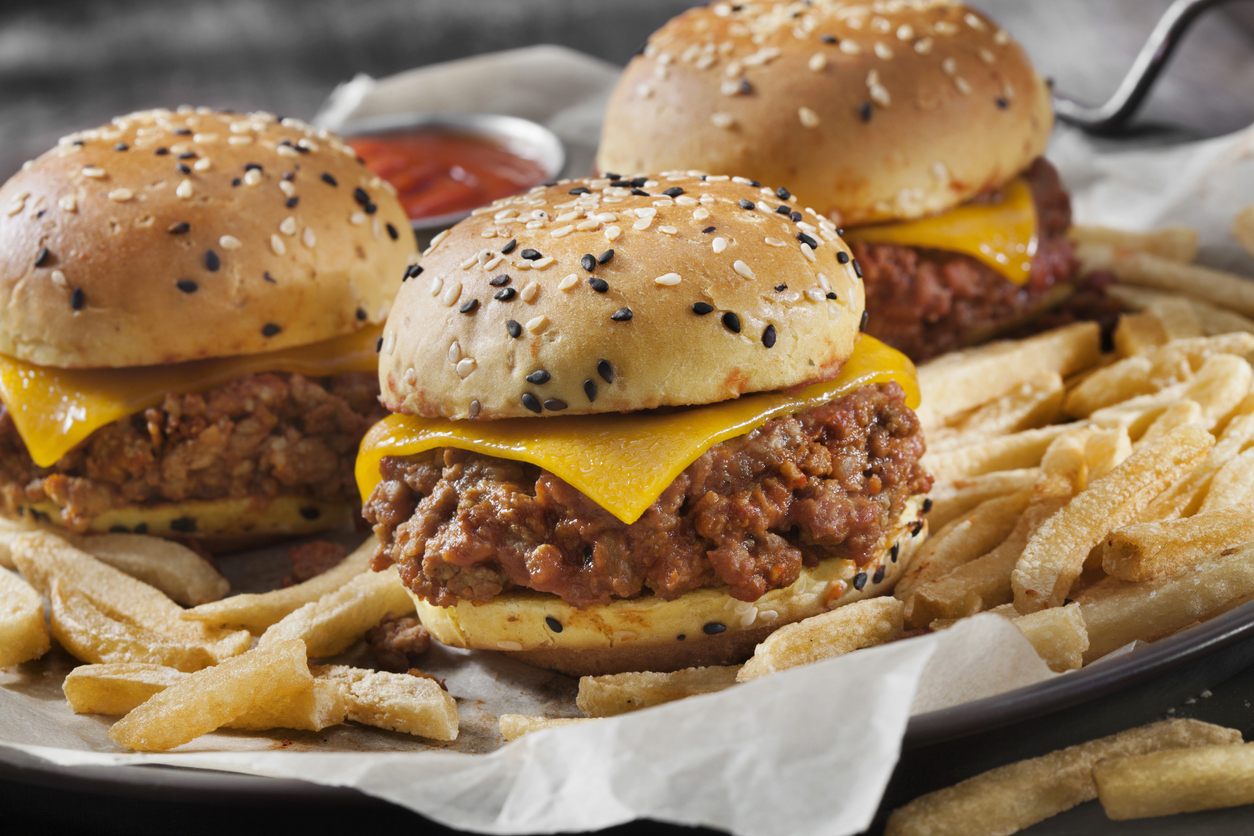 Sloppy Joe Sliders with Cheddar Cheese on a Brioche Sesame Seed Bun with Fries