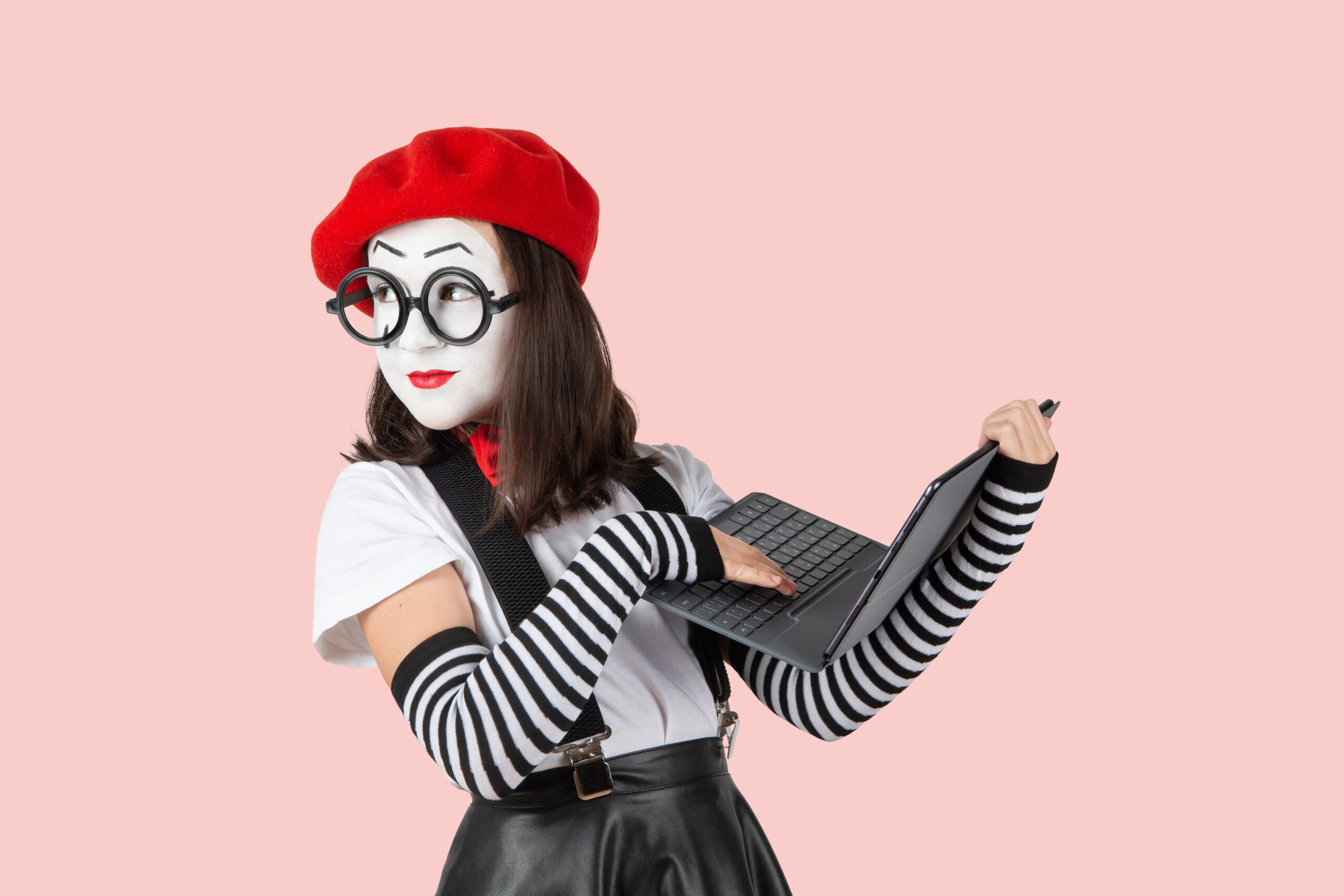 teenage girls in the image of mimes with makeup on their faces, isolate on a white background
