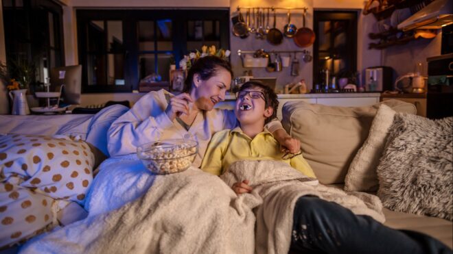 A mom and son sitting on the couch