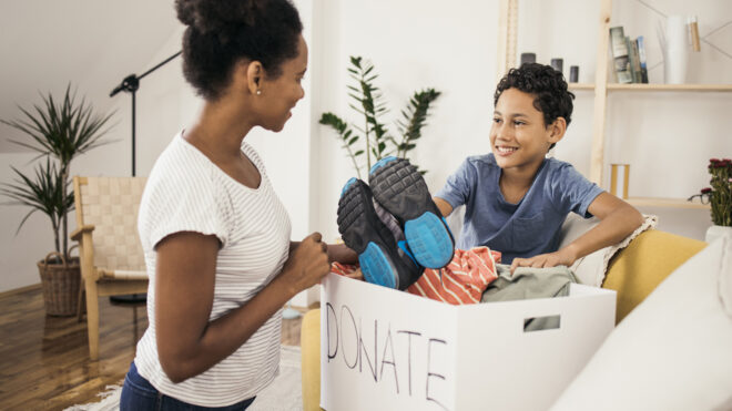 Mother and child with a donation box