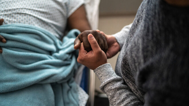 man holding woman's hand