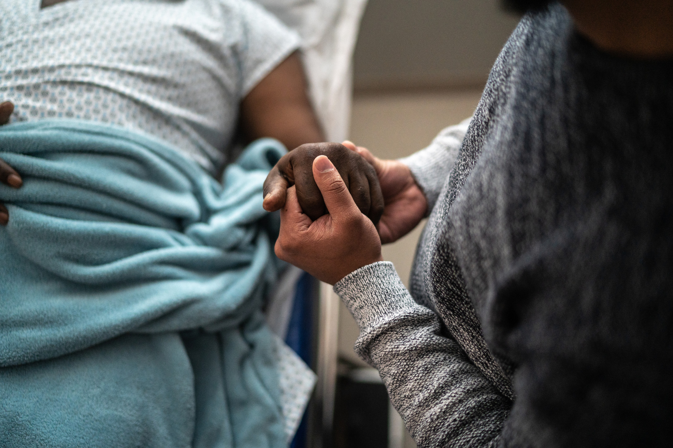 man holding woman's hand