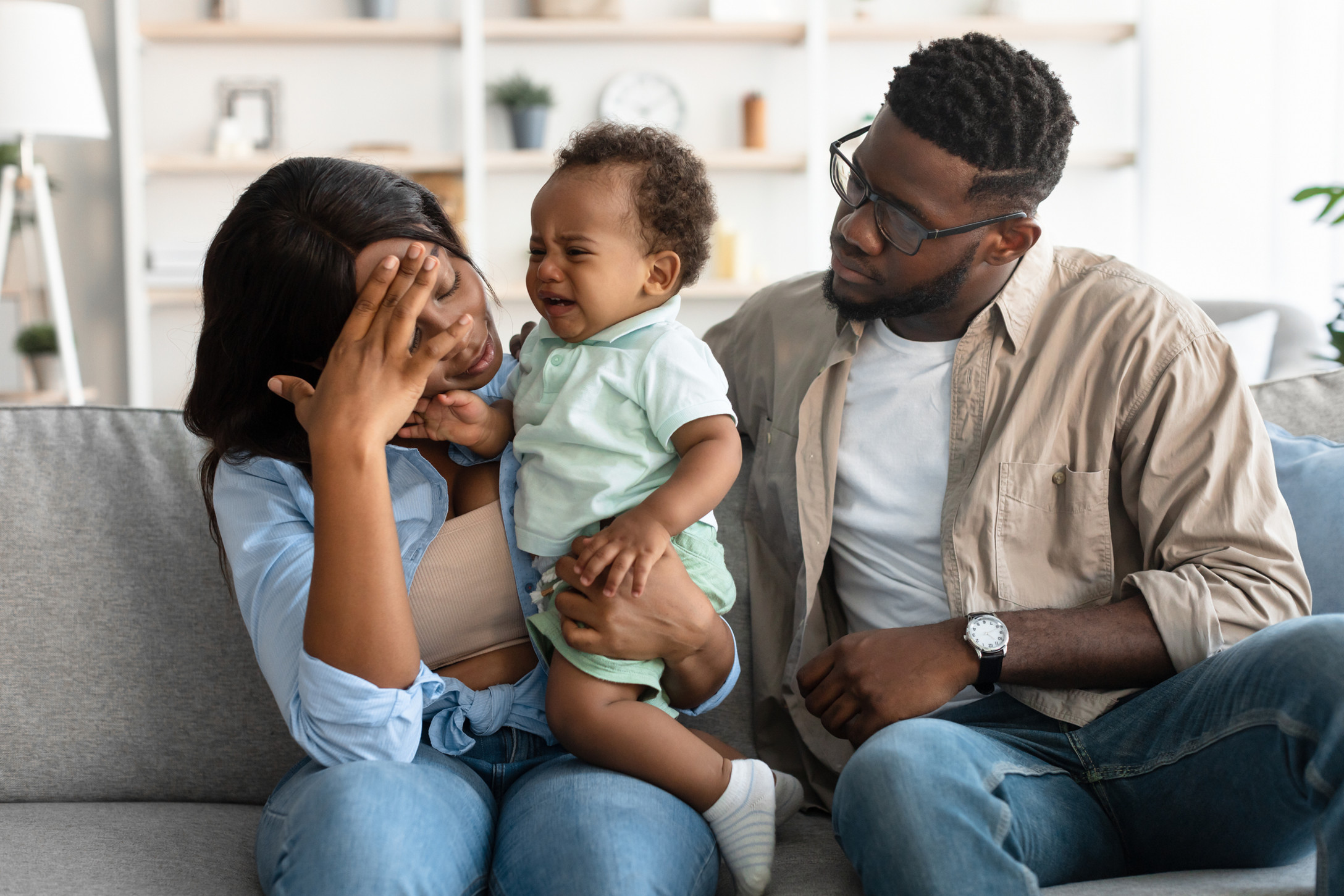couple sitting with baby