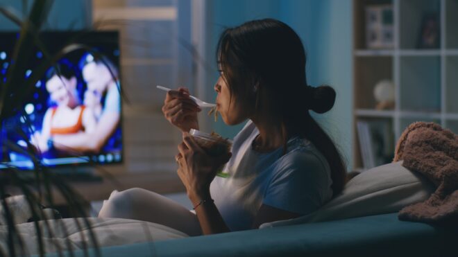 woman watching tv at night