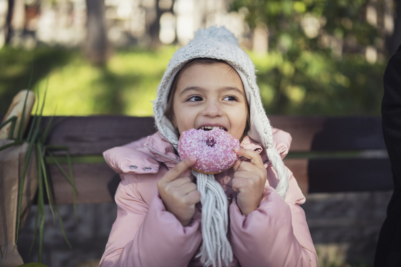 Sweet Little Girl Eating Pink Donut Sweet Little Girl Eating Pink Donut
