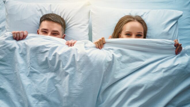 happy couple in bed