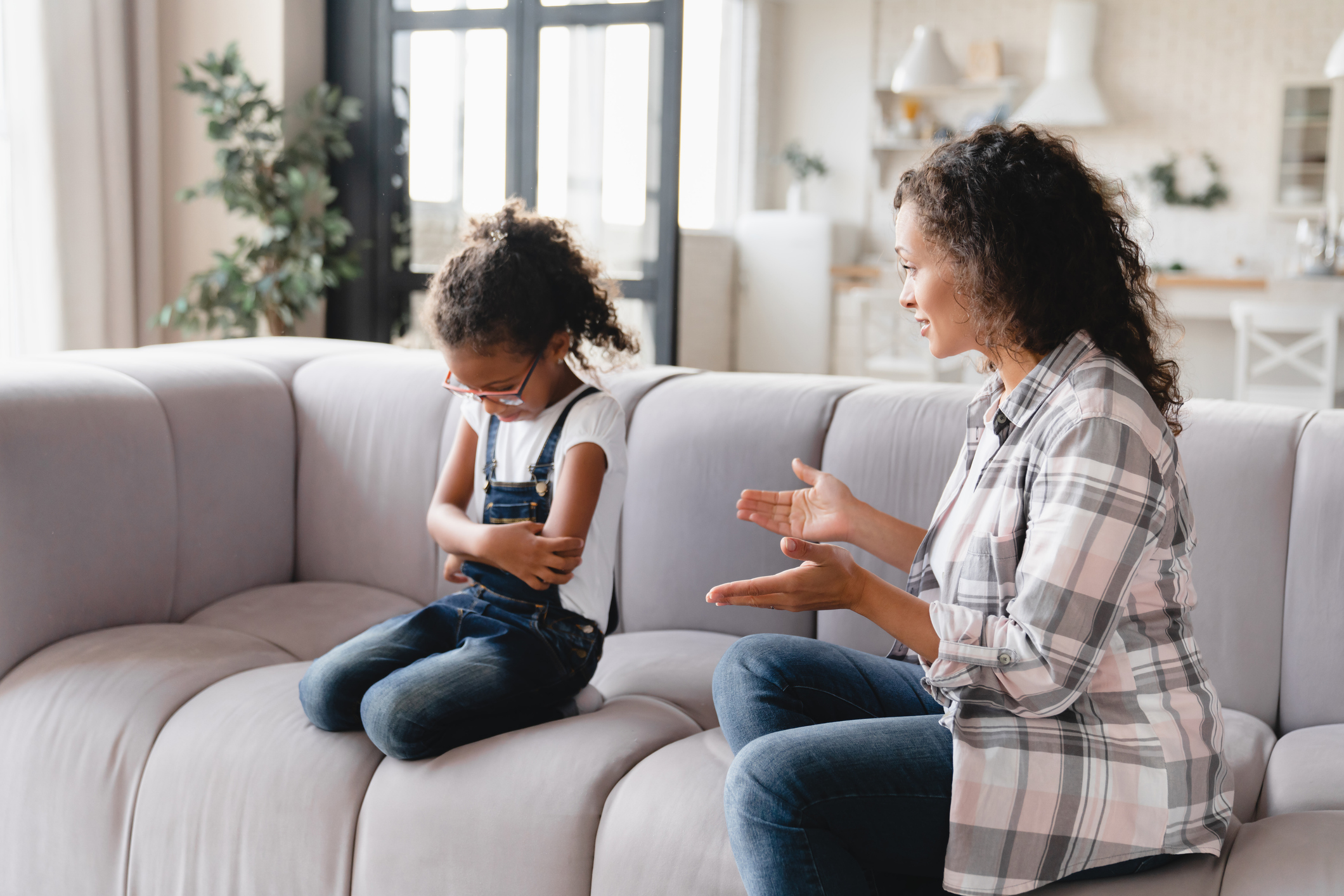 Misunderstanding between african mother and daughter. Mom crying scolding a girl for bad school marks, fault, misbehavior. Family problems. Maternity leave. PMS